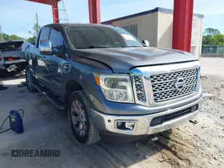 2016 Nissan Titan XD Platinum Reserve with VIN 1N6BA1F24GN516103, listed as a IAAI auction lot 41891904 with 130,993 mi miles. Bid and sale history available at carsss.com. Image 1.