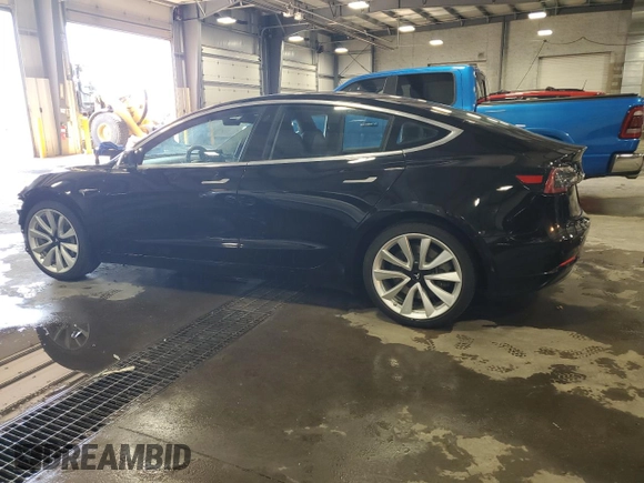 2019 Tesla Model 3 Mid Range z VIN 5YJ3E1EA4KF310792, wystawiony jako Copart lot #53031595 z przebiegiem 99 799 mil mil oraz Szkody całkowita. Historia ofert i sprzedaży dostępna na DreamBid. Obrazek 2.