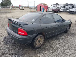 1999 Dodge Neon Competition with VIN 1B3ES47C9XD111397, listed as a IAAI auction lot 41702657 with 210,033 mi miles. Bid and sale history available at carsss.com. Image 4.