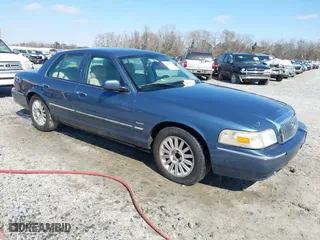 2009 Mercury Grand Marquis LS with VIN 2MEHM75VX9X632358, listed as a IAAI auction lot 41618591 with 101,765 mi miles. Bid and sale history available at carsss.com. Image 1.