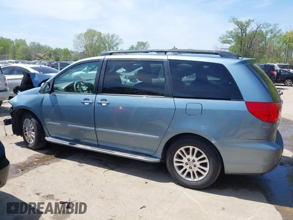 2009 Toyota Sienna XLE with VIN 5TDZK22C99S239755, listed as a IAAI auction lot 42096411 with 214,983 mi miles. Bid and sale history available at carsss.com. Image 15.