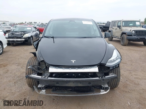 2023 Tesla Model Y Long Range with VIN 7SAYGDEEXPA044335, listed as a IAAI auction lot 42350159 with 26,731 mi miles and . Bid and sale history available at DreamBid. Image 13.