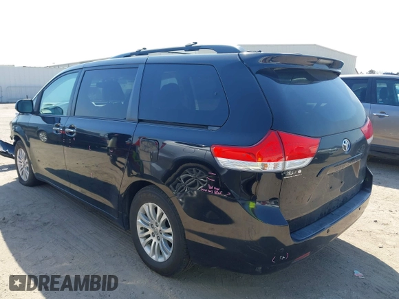 2014 Toyota Sienna XLE with VIN 5TDYK3DC2ES492554, listed as a IAAI auction lot 41685109 with 196,619 mi miles and . Bid and sale history available at DreamBid. Image 3.