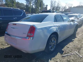 2013 Chrysler 300 with VIN 2C3CCAAG0DH657568, listed as a IAAI auction lot 41319665 with 213,034 mi miles. Bid and sale history available at carsss.com. Image 4.