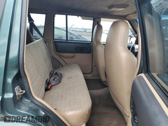 2000 Jeep Cherokee with VIN 1J4FF48S3YL149593, listed as a Copart auction lot 52489045 with 290,231 mi miles and Salvage title. Bid and sale history available at DreamBid. Image 10.