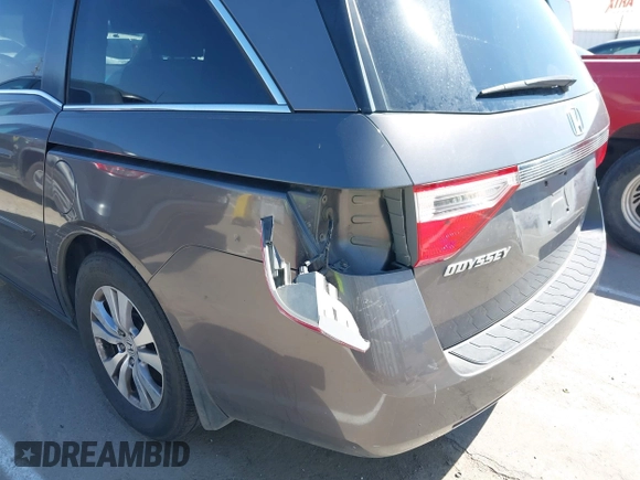 2012 Honda Odyssey EX-L with VIN 5FNRL5H65CB012428, listed as a IAAI auction lot 42164272 with 256,253 mi miles and . Bid and sale history available at carsss.com. Image 6.
