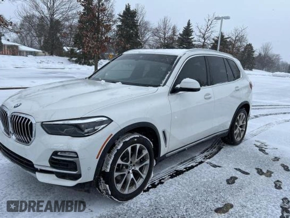 2021 BMW X5 xDrive40i with VIN 5UXCR6C03M9G52955, listed as a Copart auction lot 41009913 with 7,476 mi miles. Bid and sale history available at carsss.com. Image 2.