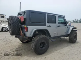 2013 Jeep Wrangler Unlimited Rubicon with VIN 1C4BJWFG5DL661282, listed as a Copart auction lot 57471035 with 128,400 mi miles and Salvage title. Bid and sale history available at DreamBid. Image 3.