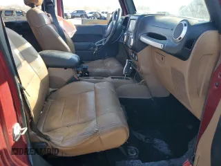2012 Jeep Wrangler Unlimited Rubicon with VIN 1C4HJWFG4CL114089, listed as a Copart auction lot 49436495 with 189,079 mi miles and Salvage title. Bid and sale history available at DreamBid. Image 7.