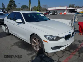 2014 BMW 3 Series 328i with VIN WBA3A5C52EJ463819, listed as a IAAI auction lot 41669717 with 111,112 mi miles. Bid and sale history available at carsss.com. Image 1.
