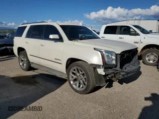 2015 GMC Yukon Denali with VIN 1GKS2CKJ0FR508598, listed as a Copart auction lot 71212924 with 133,220 mi miles and Salvage Title. Bid and sale history available at carsss.com. Image 4.
