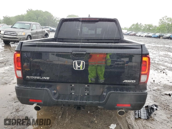 2023 Honda Ridgeline RTL with VIN 5FPYK3F51PB067811, listed as a Copart auction lot 56795995 with 21,500 mi miles and Salvage title. Bid and sale history available at DreamBid. Image 6.
