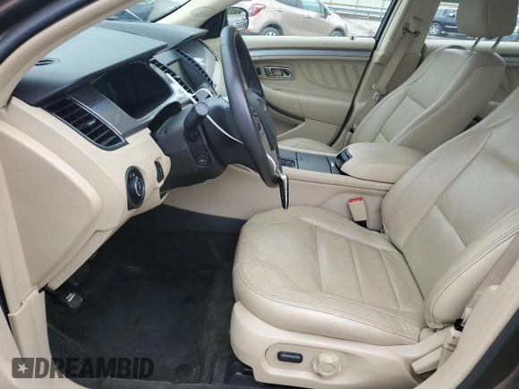 2015 Ford Taurus SEL z VIN 1FAHP2E84FG102075, wystawiony jako Copart lot #59740265 z przebiegiem 90 669 mil mil oraz Szkoda całkowita • Salvage title. Historia ofert i sprzedaży dostępna na DreamBid. Obrazek 7.