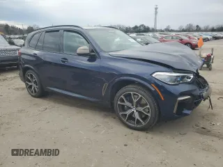 2022 BMW X5 M50i with VIN 5UXJU4C04N9J66230, listed as a Copart auction lot 86374124 with 0 mi miles and Salvage Title. Bid and sale history available at carsss.com. Image 4.