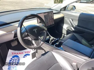 2020 Tesla Model 3 Long Range with VIN 5YJ3E1EB6LF600266, listed as a IAAI auction lot 41819374 with 28,406 mi miles. Bid and sale history available at carsss.com. Image 5.