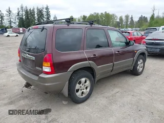 2001 Mazda Tribute LX with VIN 4F2CU08141KM10269, listed as a IAAI auction lot 42138704 with 166,825 mi miles and . Bid and sale history available at carsss.com. Image 4.
