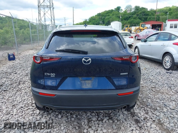2021 Mazda CX-30 Premium z VIN 3MVDMBDL7MM236474, wystawiony jako IAAI lot #42284515 z przebiegiem 58 565 mil mil oraz . Historia ofert i sprzedaży dostępna na DreamBid. Obrazek 16.