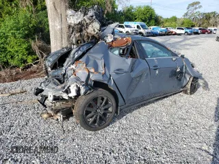2024 Mazda 3 S Carbon Edition z VIN JM1BPBLM2R1707154, wystawiony jako Copart lot #63242765 z przebiegiem Nie podano mil oraz Nie do naprawy • Non repairable. Historia ofert i sprzedaży dostępna na DreamBid. Obrazek 3.