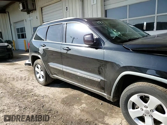2012 Jeep Grand Cherokee Laredo with VIN 1C4RJEAG2CC215525, listed as a Copart auction lot 51876105 with 148,659 mi miles and Salvage Title. Bid and sale history available at carsss.com. Image 12.