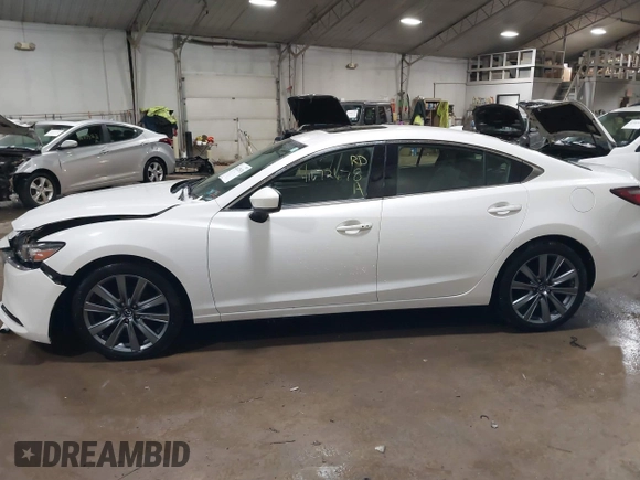 2019 Mazda 6 Grand Touring with VIN JM1GL1TYXK1505439, listed as a IAAI auction lot 41672678 with 52,990 mi miles and . Bid and sale history available at carsss.com. Image 14.
