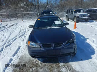 2004 Pontiac Grand Am SE with VIN 1G2NE52F24M692805, listed as a IAAI auction lot 41591014 with 137,072 mi miles. Bid and sale history available at carsss.com. Image 12.