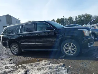 2015 GMC Yukon XL SLT with VIN 1GKS2HKC9FR159164, listed as a IAAI auction lot 41708822 with 136,730 mi miles. Bid and sale history available at carsss.com. Image 13.