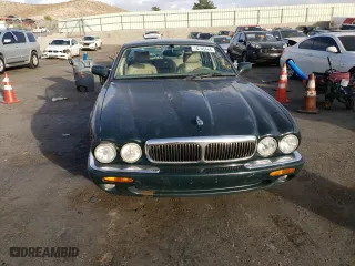 1999 Jaguar XJ with VIN SAJHD1048XC867723, listed as a Copart auction lot 76745444 with 170,999 mi miles and Salvage Title. Bid and sale history available at carsss.com. Image 5.