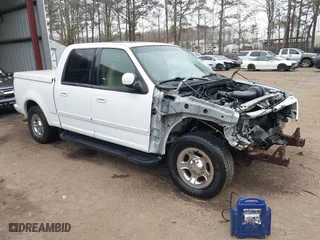 2001 Ford F-150 SuperCrew XLT with VIN 1FTRW07LX1KE14432, listed as a IAAI auction lot 41802811 with 192,696 mi miles. Bid and sale history available at carsss.com. Image 1.