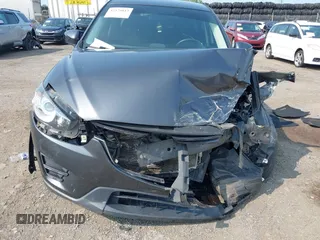 2016 Mazda CX-5 Sport with VIN JM3KE4BY7G0893984, listed as a IAAI auction lot 42479813 with Not provided miles and . Bid and sale history available at DreamBid. Image 6.