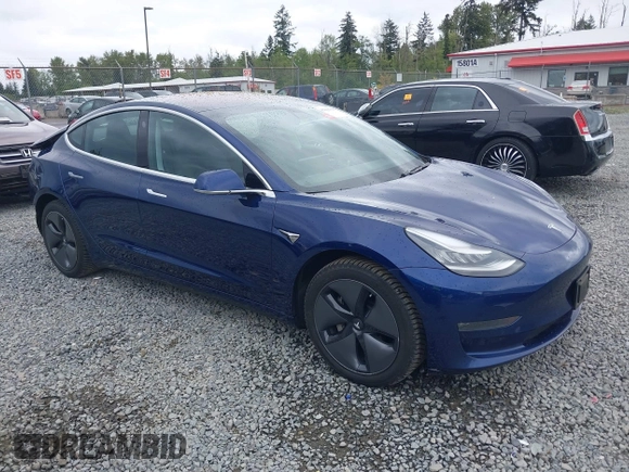 2018 Tesla Model 3 Long Range Battery z VIN 5YJ3E1EBXJF092025, wystawiony jako IAAI lot #42268369 z przebiegiem 132 687 mil mil oraz . Historia ofert i sprzedaży dostępna na DreamBid. Obrazek 1.
