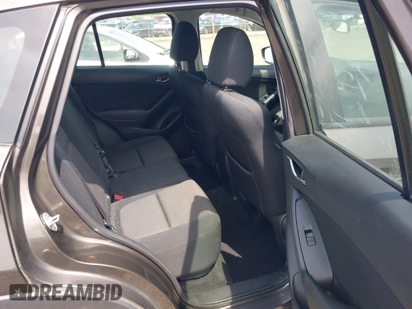 2016 Mazda CX-5 Sport with VIN JM3KE4BY8G0785812, listed as a IAAI auction lot 42324083 with 57,405 mi miles and . Bid and sale history available at DreamBid. Image 8.