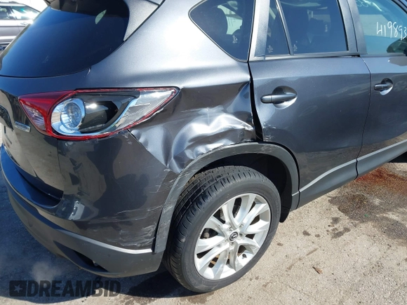 2014 Mazda CX-5 Grand Touring with VIN JM3KE4DY4E0320695, listed as a IAAI auction lot 41989350 with 169,391 mi miles and . Bid and sale history available at DreamBid. Image 12.