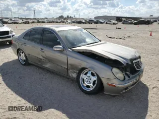 2003 Mercedes-Benz E-Class 5.0L with VIN WDBUF70J73A119596, listed as a Copart auction lot 77382424 with 237,620 mi miles and Salvage Title. Bid and sale history available at carsss.com. Image 4.