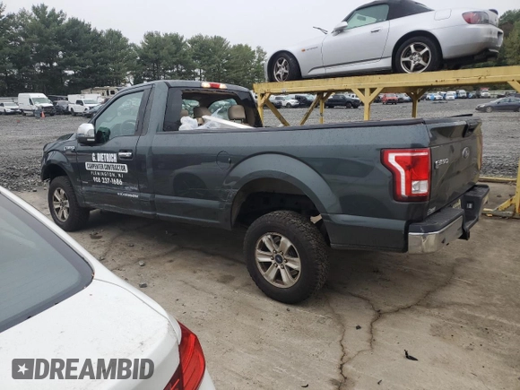 2015 Ford F-150 XL with VIN 1FTNF1EG1FKD00398, listed as a Copart auction lot 72774054 with 164,052 mi miles and Salvage title. Bid and sale history available at DreamBid. Image 2.
