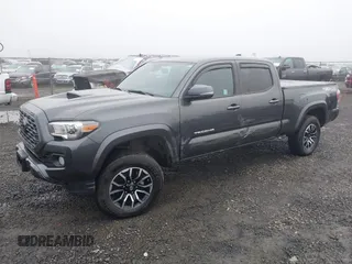 2021 Toyota Tacoma 4WD SR5 with VIN 3TMDZ5BN4MM099423, listed as a IAAI auction lot 41208397 with 62,935 mi miles. Bid and sale history available at carsss.com. Image 2.