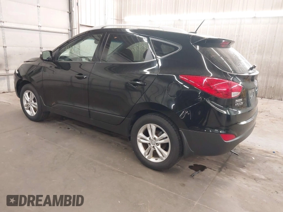 2013 Hyundai Tucson GLS with VIN KM8JU3AC8DU557445, listed as a IAAI auction lot 41839782 with 153,769 mi miles. Bid and sale history available at carsss.com. Image 3.