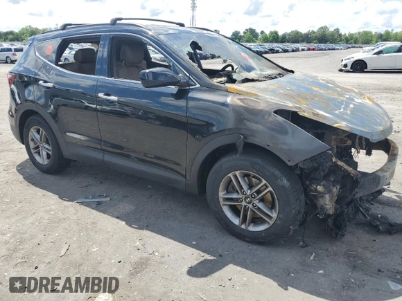 2017 Hyundai Santa Fe 2.4L z VIN 5NMZUDLB9HH013230, wystawiony jako Copart lot #55888975 z przebiegiem Nie podano mil oraz Szkoda całkowita • Salvage title. Historia ofert i sprzedaży dostępna na DreamBid. Obrazek 4.