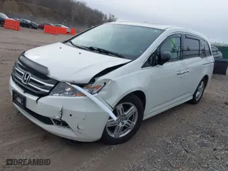 2013 Honda Odyssey Touring with VIN 5FNRL5H96DB089336, listed as a IAAI auction lot 41527990 with 128,770 mi miles. Bid and sale history available at carsss.com. Image 2.