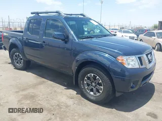2015 Nissan Frontier Pro-4X z VIN 1N6AD0EV7FN713290, wystawiony jako IAAI lot #42666962 z przebiegiem 65 864 mil mil oraz . Historia ofert i sprzedaży dostępna na DreamBid. Obrazek 1.
