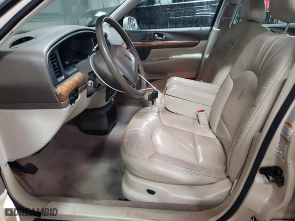 2000 Lincoln Continental with VIN 1LNHM97V2YY760288, listed as a Copart auction lot 80894624 with 115,785 mi miles and Salvage Title. Bid and sale history available at carsss.com. Image 7.