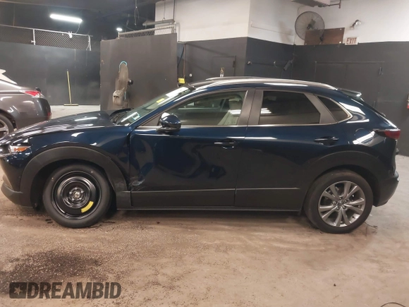 2024 Mazda CX-30 S Preferred z VIN 3MVDMBCM9RM700673, wystawiony jako IAAI lot #42417844 z przebiegiem 7 385 mil mil oraz . Historia ofert i sprzedaży dostępna na DreamBid. Obrazek 14.