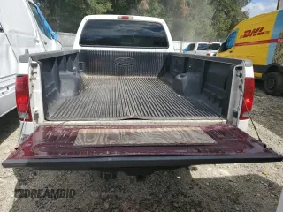 2000 Ford Super Duty F-250 XL with VIN 1FTNF20F9YEC91357, listed as a Copart auction lot 76673234 with 318,306 mi miles and Salvage Title. Bid and sale history available at carsss.com. Image 6.