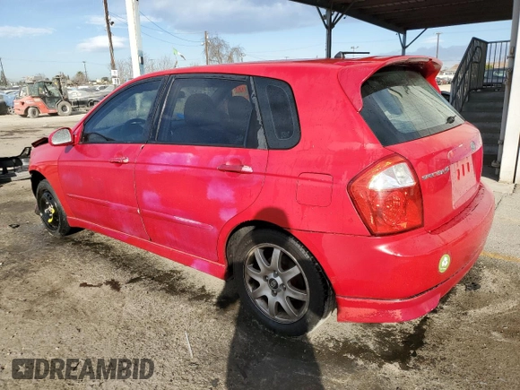 2005 Kia Spectra with VIN KNAFE162255129620, listed as a Copart auction lot 86822464 with 249,516 mi miles and Salvage Title. Bid and sale history available at carsss.com. Image 2.