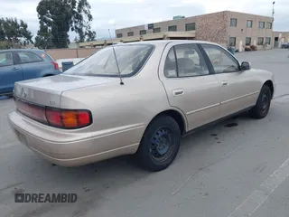 1994 Toyota Camry LE with VIN JT2SK12E0R0269820, listed as a IAAI auction lot 41908360 with 184,739 mi miles. Bid and sale history available at carsss.com. Image 4.