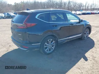 2020 Honda CR-V Touring with VIN 2HKRW2H98LH626651, listed as a IAAI auction lot 41668951 with 64,391 mi miles and . Bid and sale history available at DreamBid. Image 4.