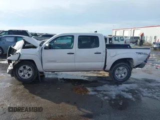 2014 Toyota Tacoma with VIN 3TMLU4ENXEM134872, listed as a IAAI auction lot 41303669 with 167,548 mi miles. Bid and sale history available at carsss.com. Image 15.