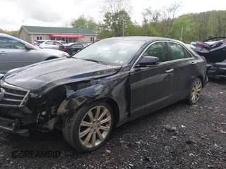 2013 Cadillac ATS Premium AWD z VIN 1G6AL5S36D0111869, wystawiony jako IAAI lot #42199637 z przebiegiem 148 404 mil mil oraz . Historia ofert i sprzedaży dostępna na DreamBid. Obrazek 2.