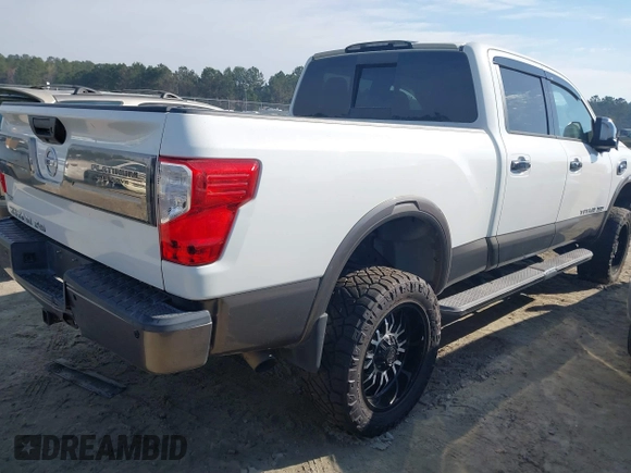 2016 Nissan Titan Platinum Reserve z VIN 1N6BA1F22GN509568, wystawiony jako IAAI lot #41766629 z przebiegiem 94 991 mil mil oraz . Historia ofert i sprzedaży dostępna na DreamBid. Obrazek 4.