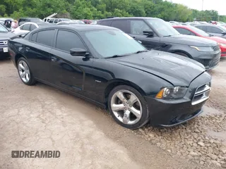 2014 Dodge Charger RT with VIN 2C3CDXCT4EH340887, listed as a IAAI auction lot 42113933 with 143,897 mi miles. Bid and sale history available at carsss.com. Image 1.