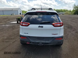 2014 Jeep Cherokee Trailhawk z VIN 1C4PJMBS5EW201897, wystawiony jako Copart lot #57378795 z przebiegiem 172 715 mil mil oraz Szkody całkowita. Historia ofert i sprzedaży dostępna na DreamBid. Obrazek 6.